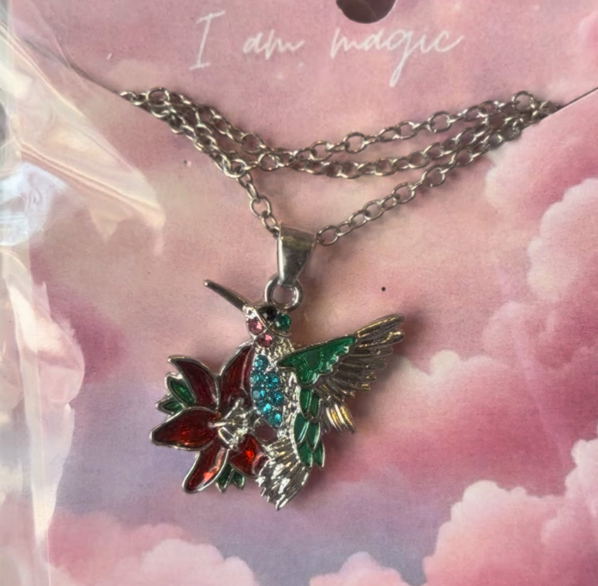Colibri con flor